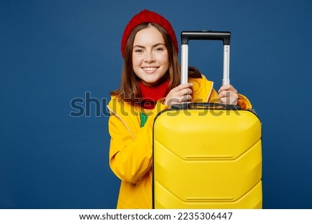 Similar – Image, Stock Photo Traveling woman in outerwear using smartphone in nature