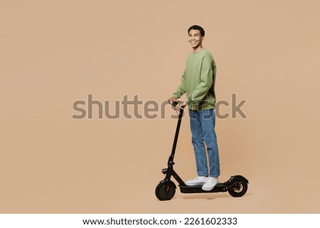 Similar – Image, Stock Photo Man riding an e-scooter