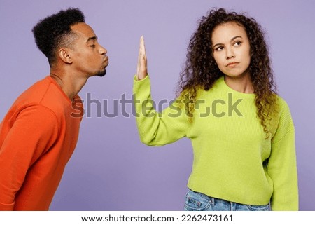 Similar – Image, Stock Photo Young ethnic man kissing cheek of smiling girlfriend working remotely on netbook in cafeteria