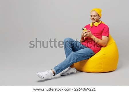 Similar – Image, Stock Photo Queer speaking on smartphone on white background