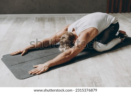 Similar – Image, Stock Photo Man doing yoga by the beach