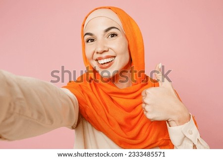 Similar – Image, Stock Photo Asian female taking selfie in underground passage