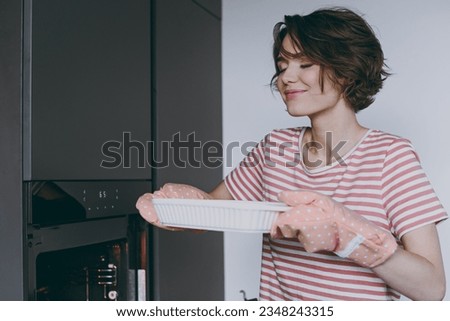 Similar – Image, Stock Photo Casserole is put in the oven