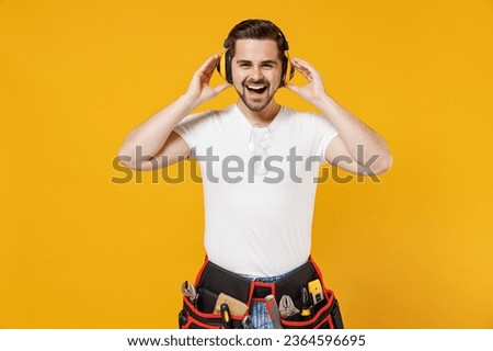 Similar – Image, Stock Photo Repairman with headphones in workshop