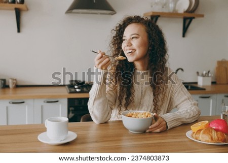 Image, Stock Photo Ethnic woman eating breakfast on bed