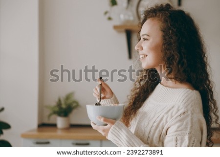 Similar – Image, Stock Photo Ethnic woman eating breakfast on bed