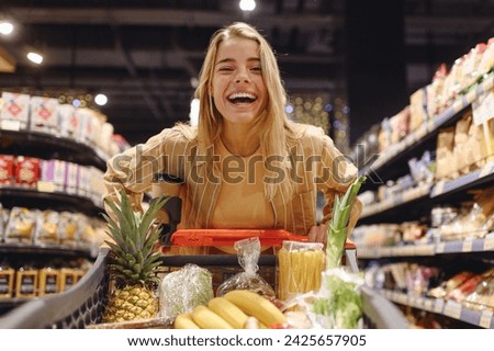 Image, Stock Photo Woman with shopping cart in the shop