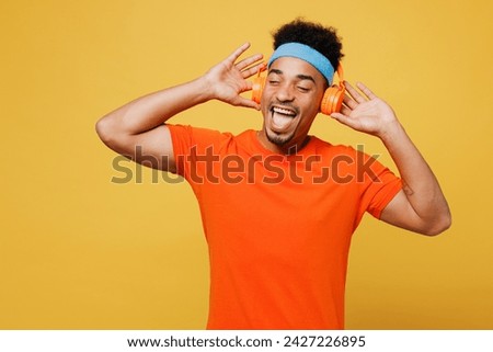 Similar – Image, Stock Photo Ethnic sportsman in headphones getting ready for running