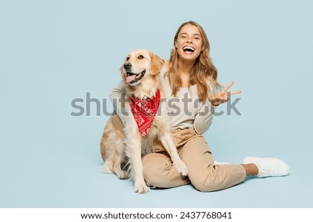 Similar – Image, Stock Photo Woman playing with purebred dogs on sofa