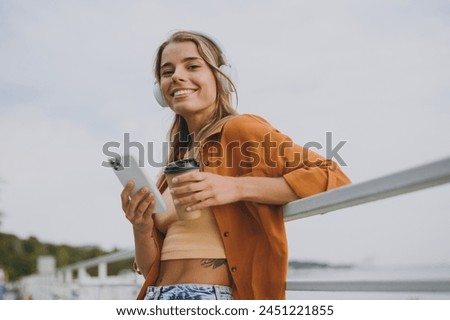 Similar – Image, Stock Photo Young woman listening to music