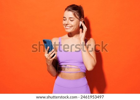 Similar – Image, Stock Photo Sportive woman in headphones using social media on smartphone