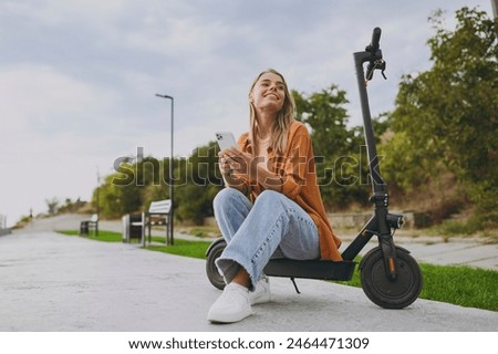 Similar – Image, Stock Photo Pensive Young Woman sitting on the floor