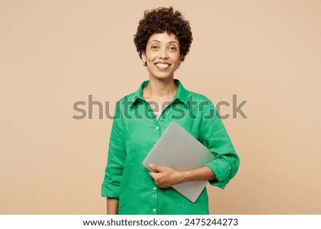 Similar – Image, Stock Photo Young woman wearing green oversize sweater enjoying a windy day in a colorful city