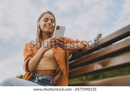 Similar – Image, Stock Photo Woman talking by phone on bed in morning.