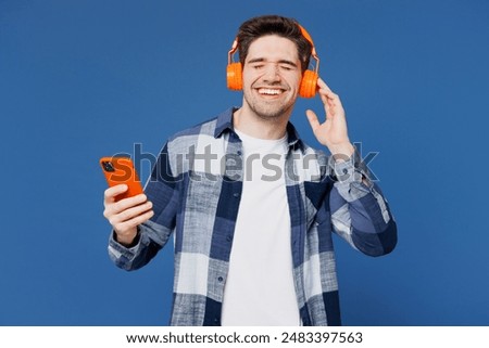 Similar – Image, Stock Photo A man with headphones pulls on his tongue with pliers