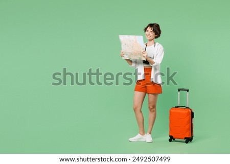 Similar – Image, Stock Photo Casual woman on airport terminal talking on the cell phone, waiting for flight departure with luggage on trolley cart.