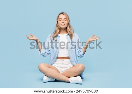 Similar – Image, Stock Photo Adult people practicing yoga together in balance pose and stretching body in light contemporary studio