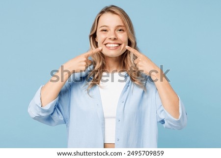 Similar – Image, Stock Photo A smiling girl in a Christmas hat sits on the sofa and communicates via video link with friends and shows them her gift. Girl congratulates friends and family on holidays