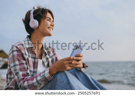 Similar – Image, Stock Photo Young woman listening to music