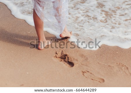 Similar – Image, Stock Photo Crop woman on sandy beach during vacation