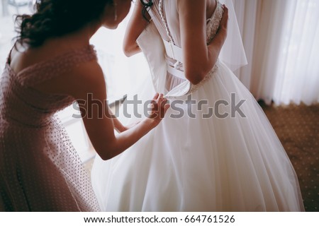 Similar – Image, Stock Photo bride trying on white wedding dress