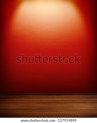 interior room with red wall and spot
