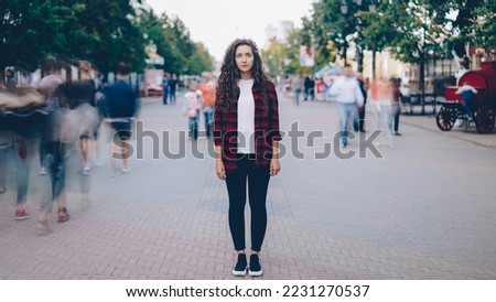 Similar – Image, Stock Photo Lonely woman with long hair looking at a hill