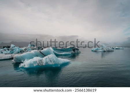 Similar – Image, Stock Photo Glacier Lagoon with icebergs from above. Aerial View. Cracked Ice from drone view. Background texture concept.
