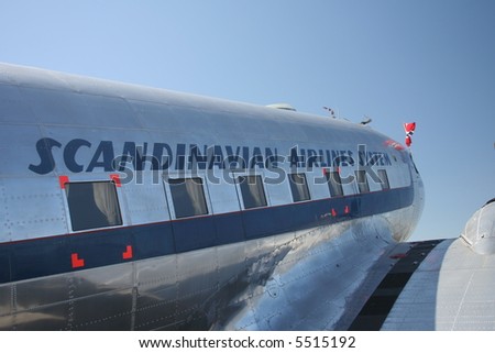 SAS DC-3 airplane, with the Norwegian flag  in the front