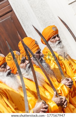 CREMONA - APRIL 13: old men of the Sikh religion in procession through the spring festival Vaisakhi, April 13, 2013 in Cremona, Lombardia, Italy. the Sikh festival takes place every year.
