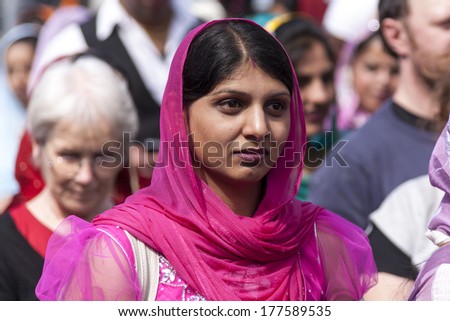 CREMONA - APRIL 13: young woman of the Sikh religion in procession through the spring festival Vaisakhi, April 13, 2013 in Cremona, Lombardia, Italy. the Sikh festival takes place every year.