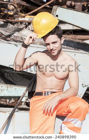 young worker in a junkyard