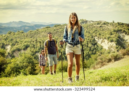 group of hikers in the mountain in single file