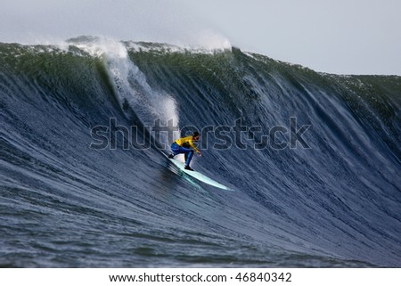 HALF MOON BAY, CA - FEBRUARY 13: Shane Desmond catches a wave in the 2009/2010 Mavericks Surf Contest February 13, 2010 in Half Moon Bay, California
