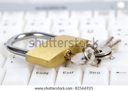Padlock and keys on computer keyboard; internet security concept.