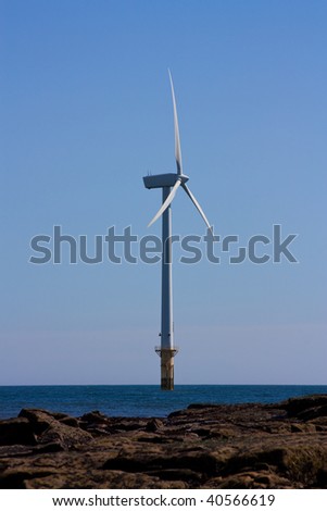 Single offshore wind turbine part of a larger wind farm at cambois beach blyth, northumberland.