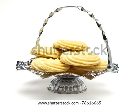 Viennese Swirl Biscuits on fancy chrome platter isolated on white.