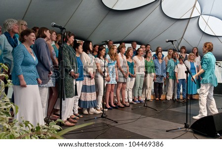 EXETER -  JUNE 2: World Music Choir performing live on the Global Community Stage at the Exeter Respect Festival 2012 on June 2, 2012 in Exeter, UK