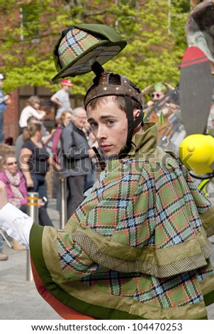 EXETER - MAY 18: Sherlock Holmes, Joshua Clarke, walks through the streets of Exeter as part of the Battle for the Winds Parade on May 18, 2012 in Exeter, UK