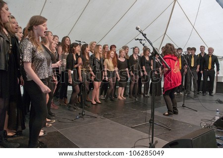 EXETER - JUNE 3: Singers from University of Exeter Soul Choir perform live on the Global Community Stage at theExeter Respect Festival on June 3, 2012 in Exeter, UK