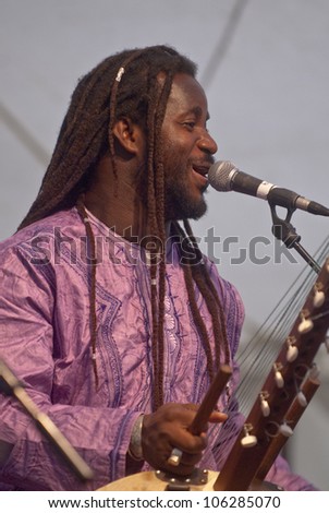 EXETER - JUNE 3: Modou N\'Diaye plays the Kora live on the Global Community Stage at the ExeterExeter Respect Festival on June 3, 2012 in Exeter, UK