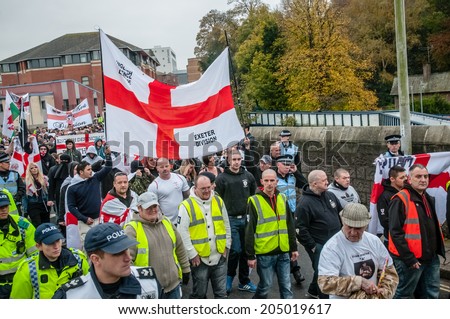 EXETER, UK - NOVEMBER 16: English Defence League members marching along New North Street during the English Defence League march and rally November 16, 2013 in Exeter, Devon, UK