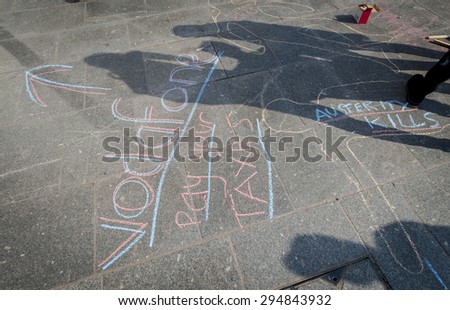 EXETER - JULY 8: Vodaphone pay your taxes in the shadows during the Exeter Budget Day Action #AusterityKills in Exeter City Centre on july 8th, 2015 in Bedford Square, Exeter, UK