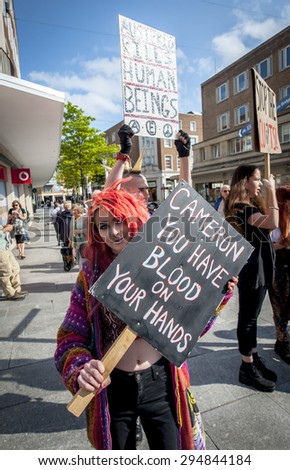 EXETER - JULY 8: A protester holds a sign which says \