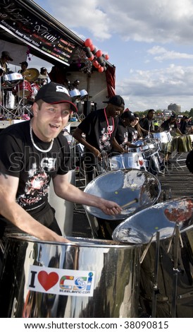 Hyde Park, London-August 29: Band member from  CIS Band Trust playing steel drum at the Notting Hill Panorama Championships, 29th August 2009 in Central London
