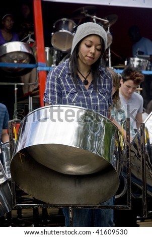 LONDON – AUGUST 29: Steel-drummers from the Croydon Steel Orchestra play steel drum at the Notting Hill Panorama Championships on August 29, 2009 in Hyde Park, London, England.