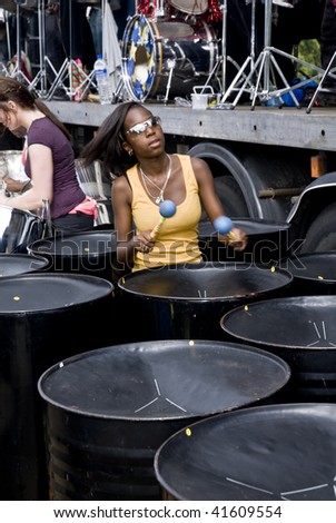 LONDON – AUGUST 29: Steel-drummers from the CIS Band Trust play steel drum at the Notting Hill Panorama Championships on August 29, 2009 in Hyde Park, London, England.