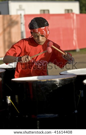 LONDON - AUGUST 29: Steel-drummer from the Croydon Steel Orchestra playing steel drums at the Notting Hill Panorama Championships on August 29, 2009 in Hyde Park, London, England.
