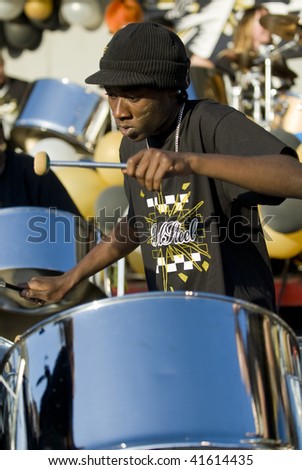 LONDON - AUGUST 29: Steel-drummer from the Real Steel Steel-band  playing steel drums at the Notting Hill Panorama Championships on August 29, 2009 in Hyde Park, London, England.