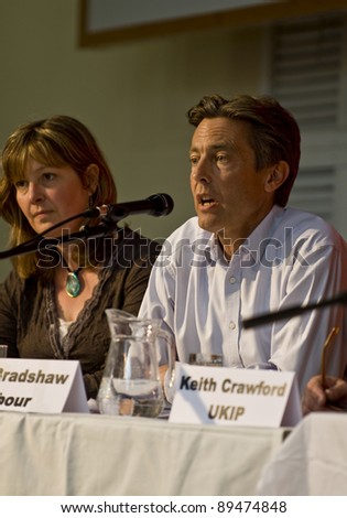 EXETER, UNITED KINGDOM - APRIL 21: Ben Bradshaw, Labour Party Candidate for Exeter, converses with other candidates at the Question Time-style event on Homelessness and Social Exclusion in Exeter, United Kingdom on April 21, 2010.